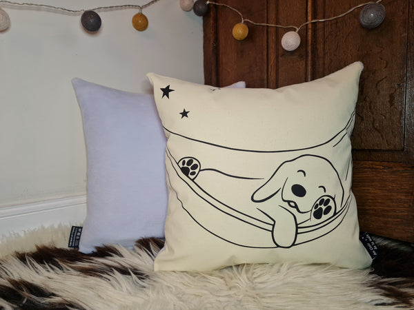 Coussin phosphorescent Chien au hamac.